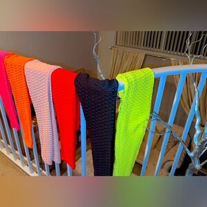 Quantity 3 Small leggings colors are Red, Black and Hot pink